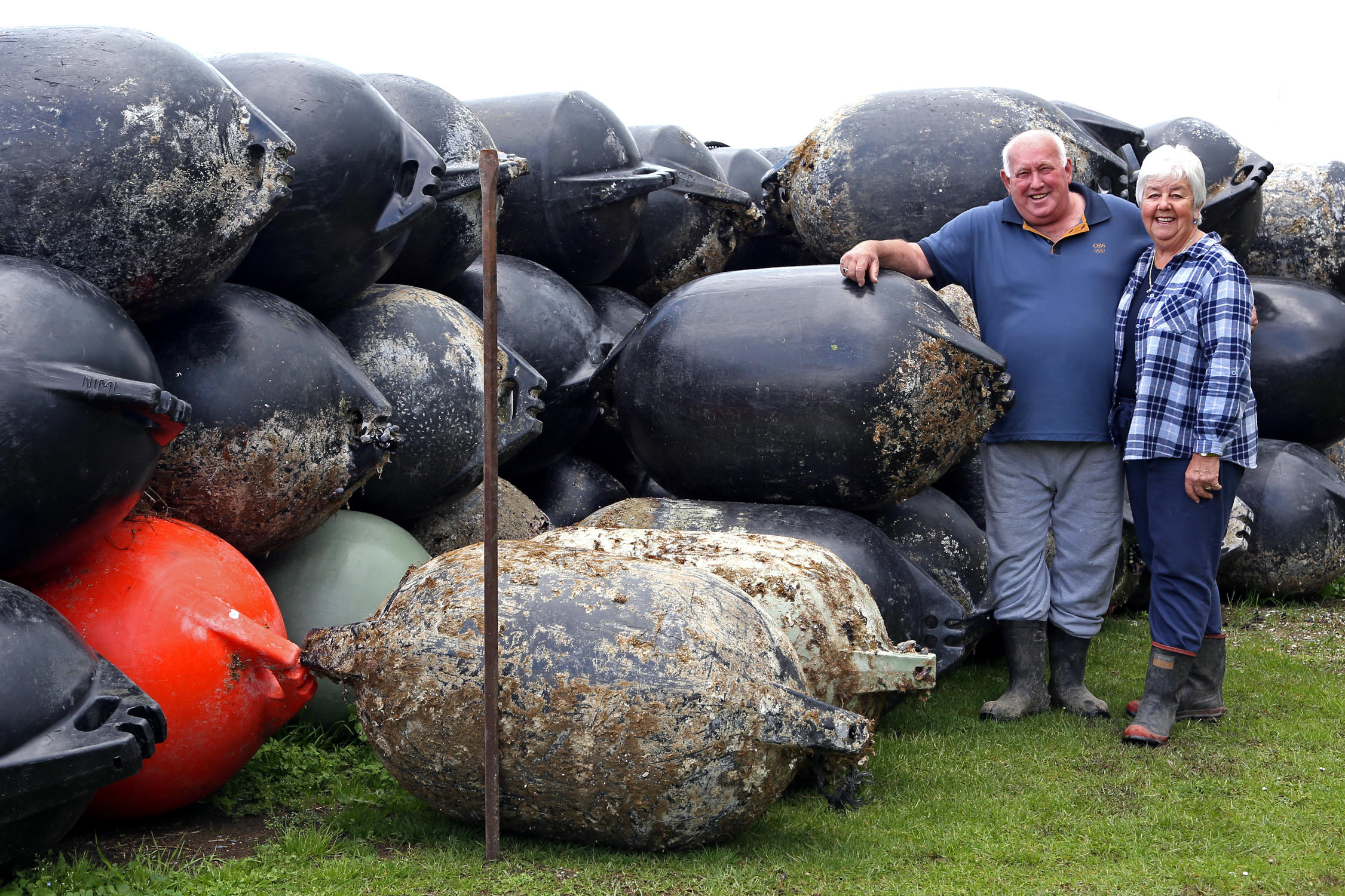 John and Noleen Kuyper with a stack of mussel buoys